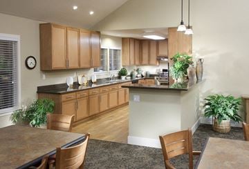 Citrus Heights apartment for rent - A kitchen with wooden cabinets and a granite countertop.