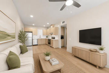 Sacramento apartment for rent - A living room with a white couch and a wooden coffee table.