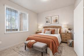 Orange apartment for rent - A bedroom with a bed, nightstand, and window at The Orion Senior Apartments - Orange, CA Apartments, Apartments, Orange, CA