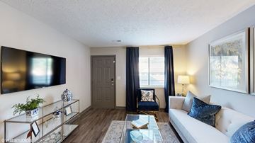 Westerville apartment for rent - a living room with a white couch and a tv