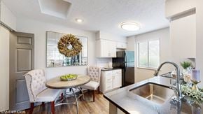 Dublin apartment for rent - a kitchen with a sink and a table with chairs at Karric Place of Dublin Apartments, Ohio, 43016