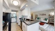 Columbus apartment for rent - an open kitchen and living room with a black counter top at Runaway Bay Apartments, Columbus, 43204