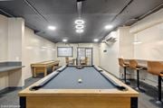 St. Louis apartment for rent - a game room with a pool table and a scoreboard  at The Embassy in St Louis