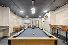 St. Louis apartment for rent - a game room with a pool table and a scoreboard  at The Embassy in St Louis