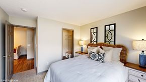 Columbus apartment for rent - a bedroom with a large bed and a closet at Springburne at Polaris Apartments, Columbus