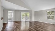 Memphis apartment for rent - A spacious room with wooden floors and a large window.