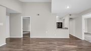 Memphis apartment for rent - A spacious living room with wood flooring and white walls.
