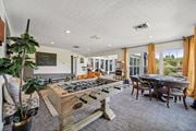 Columbus apartment for rent - A room with a pool table and a chalkboard on the wall.