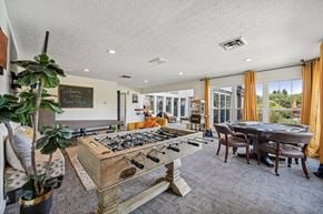 Columbus apartment for rent - A room with a pool table and a chalkboard on the wall.