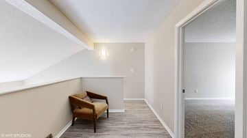 Cordova townhouse for rent - a living room with a couch and a chair in front of a window