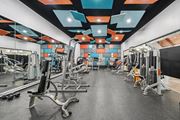 Columbus apartment for rent - A gym with a variety of equipment including weights and machines.