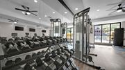 Memphis apartment for rent - A gym with a row of dumbbells and weight machines.