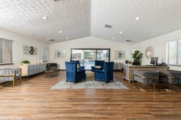 Columbus apartment for rent - a living room with blue chairs and a large window