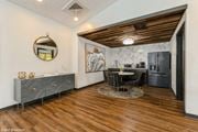 Columbus apartment for rent - a kitchen and dining room with a black refrigerator and a table and chairs at Springburne at Polaris Apartments, Ohio