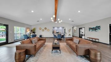 Memphis apartment for rent - A living room with brown leather couches and a coffee table.