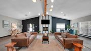 Memphis apartment for rent - A living room with a fireplace and a large couch. at The District Apartments, Tennessee