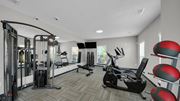 Memphis apartment for rent - A well-equipped gym with a variety of exercise machines. at The District Apartments, Memphis, TN