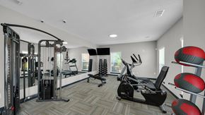 Memphis apartment for rent - A well-equipped gym with a variety of exercise machines. at The District Apartments, Memphis, TN