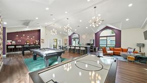 Cordova townhouse for rent - A room with a pool table and a billiard table.