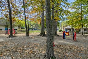 Westerville apartment for rent - a playground in a park with trees and playground equipment at Silvertree at Little Turtle Apartments, Ohio, 43081