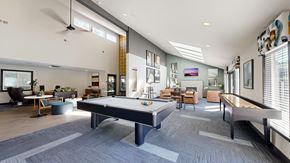 Tacoma apartment for rent - A spacious room with a pool table and comfortable seating.