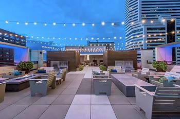Outdoor rooftop lounge with city views