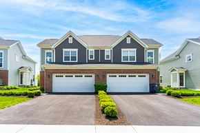 Lewis Center townhouse for rent - A two-car garage is in front of a house.