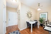 Columbus apartment for rent - a dining room with a table and chairs and a mirror