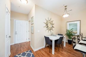 Columbus apartment for rent - a dining room with a table and chairs and a mirror