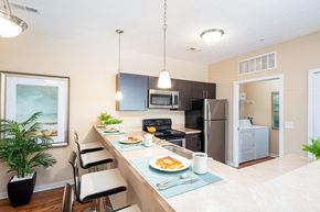 Columbus apartment for rent - a kitchen with a long counter with plates of food