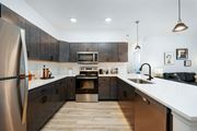 Delaware apartment for rent - a large kitchen with wooden cabinets and stainless steel appliances