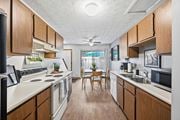 Columbus townhouse for rent - A kitchen with wooden cabinets and a white countertop.