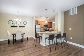 Westerville townhouse for rent - an open kitchen and dining area with a marble counter top