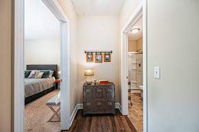 Westerville townhouse for rent - a living room with luggage on the floor and a staircase