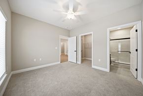 Mount Vernon apartment for rent - A spacious room with a ceiling fan and carpeted floor.