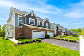 Lewis Center townhouse for rent - A row of houses with a clear blue sky above them.