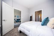 Columbus apartment for rent - a bedroom with a white bed and a closet