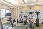 Westerville apartment for rent - a gym with cardio machines and weights at the enclave apartments