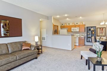 Westerville apartment for rent - a living room and kitchen with a couch and a table