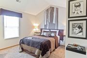 Westerville apartment for rent - a bedroom with a bed and pictures on the wall