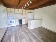 Columbus townhouse for rent - a kitchen with white cabinets and a wooden ceiling