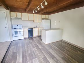 Columbus townhouse for rent - a kitchen with white cabinets and a wooden ceiling