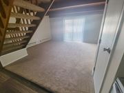 Columbus townhouse for rent - a view from the bottom of the stairs looking into the living room
