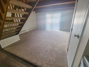Columbus townhouse for rent - a view from the bottom of the stairs looking into the living room
