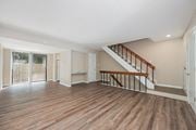 Worthington townhouse for rent - the living room and entryway of a house with a hard wood floor and stairs