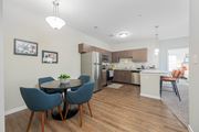 Columbus apartment for rent - an open kitchen and dining area with a table and chairs