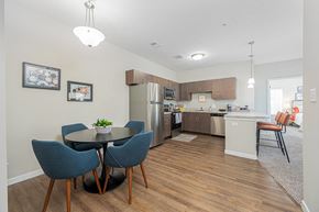 Columbus apartment for rent - an open kitchen and dining area with a table and chairs