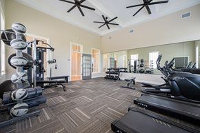 Sunbury apartment for rent - A well-equipped gym with a variety of exercise machines and weights.