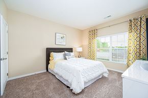 Columbus apartment for rent - a bedroom with a bed and a large window