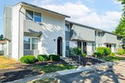 Circleville apartment for rent - a white building with a sidewalk in front of it